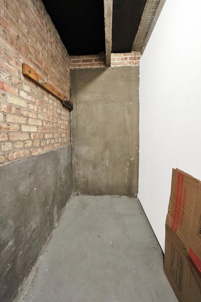 below grade area with brick wall