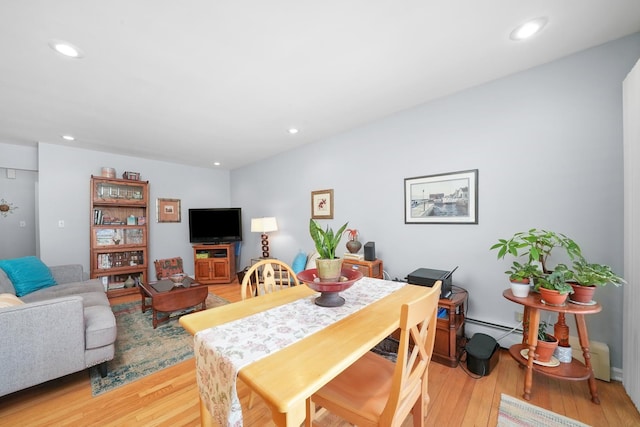dining area with recessed lighting, light wood-style floors, and a baseboard radiator