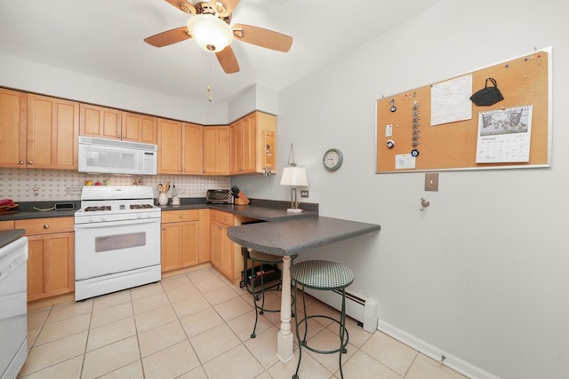 kitchen featuring dark countertops, tasteful backsplash, ceiling fan, light tile patterned floors, and white appliances