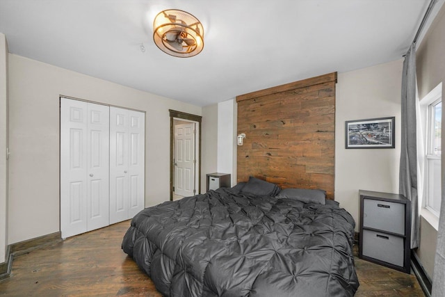 bedroom featuring a closet and wood finished floors