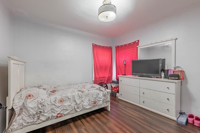 bedroom featuring wood finished floors