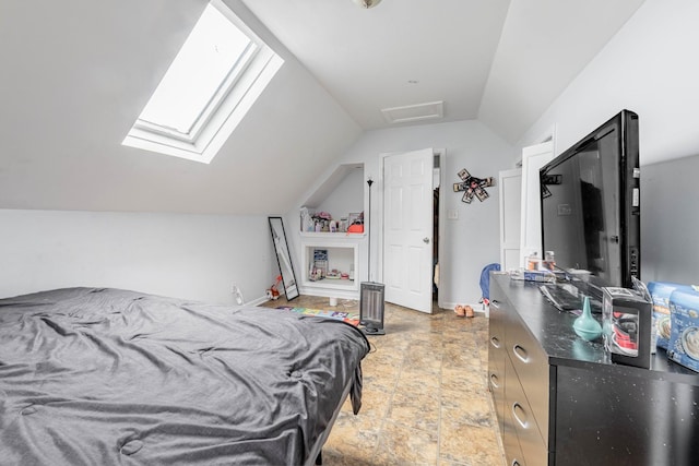 bedroom with baseboards and lofted ceiling