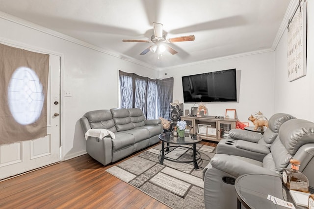 living area with ceiling fan, wood finished floors, and crown molding