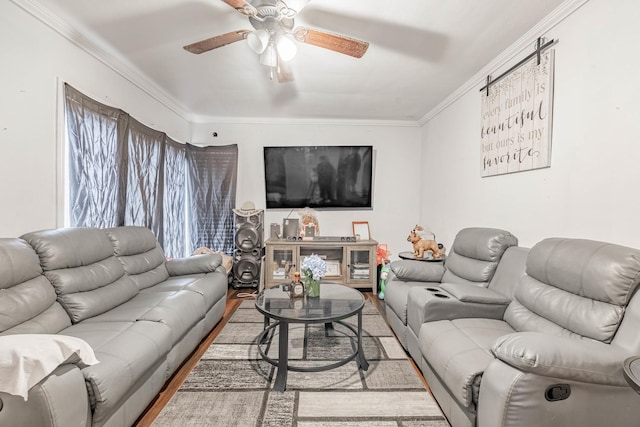 living room featuring ceiling fan, wood finished floors, and ornamental molding