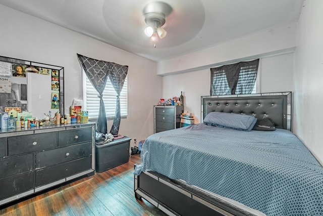 bedroom with wood finished floors and ceiling fan