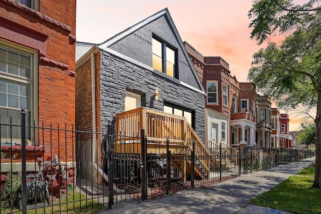 exterior space featuring a residential view and fence