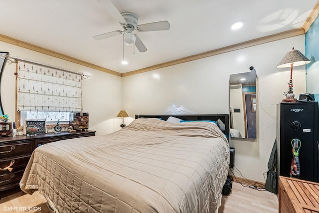 bedroom with ceiling fan, baseboards, light wood-style flooring, and crown molding