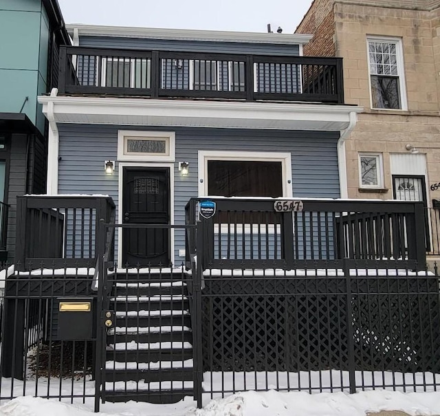 view of property featuring a balcony