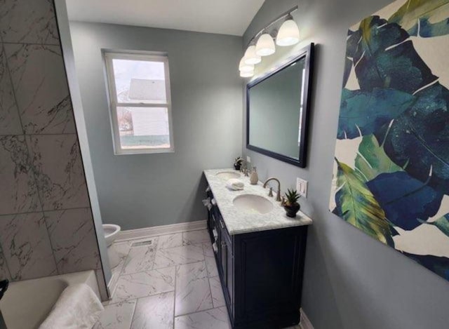 full bathroom featuring a sink, baseboards, and marble finish floor