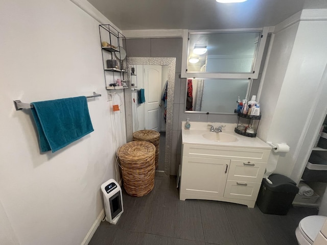 bathroom with vanity and toilet