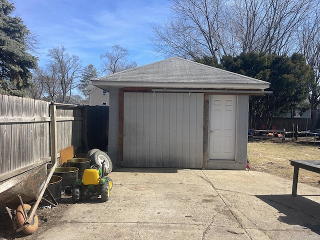 view of shed featuring a fenced backyard and a trampoline