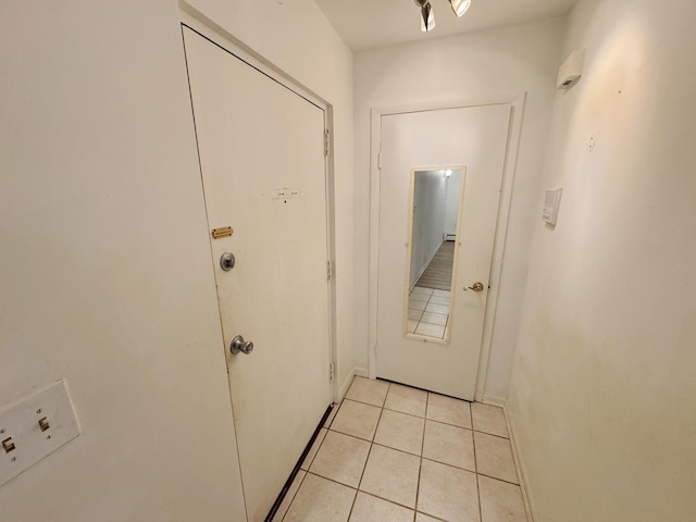 entryway featuring light tile patterned flooring