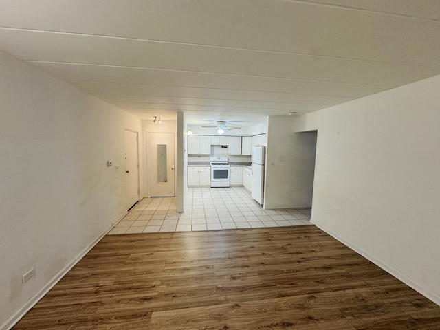 corridor featuring light wood-style flooring