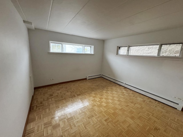 unfurnished room featuring baseboards and baseboard heating