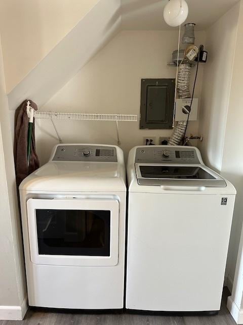 washroom with electric panel, laundry area, and separate washer and dryer