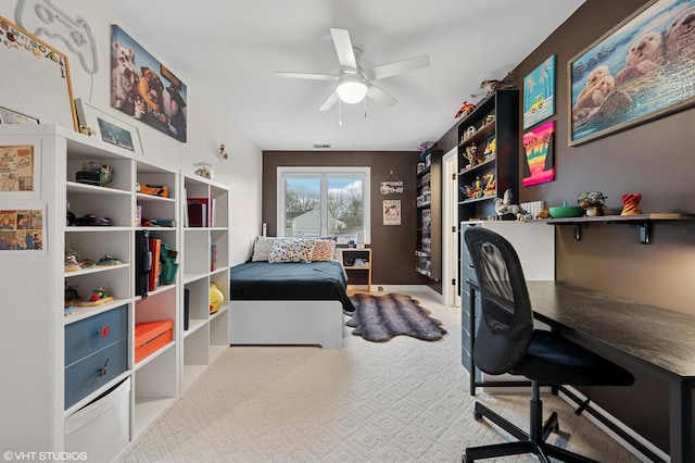 bedroom featuring a ceiling fan and carpet