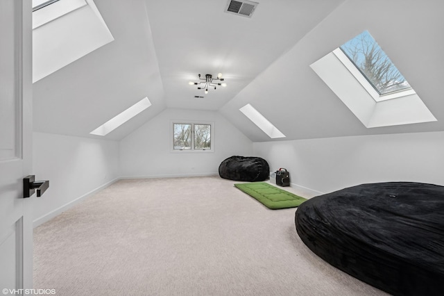 additional living space featuring visible vents, carpet floors, baseboards, and vaulted ceiling with skylight