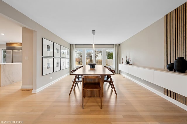 dining area with recessed lighting, baseboards, and light wood-style floors