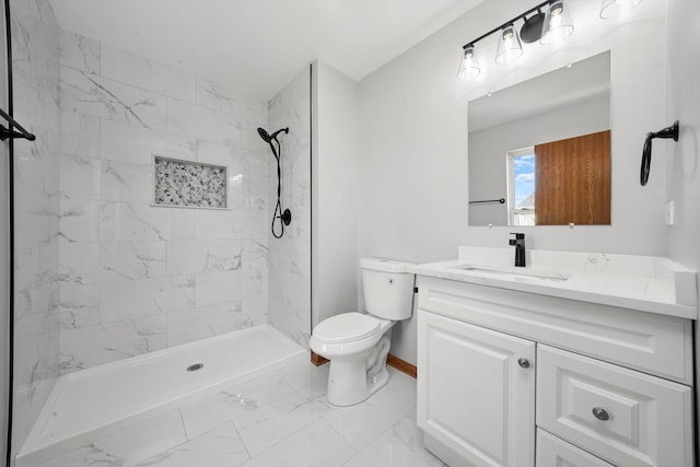 full bath featuring tiled shower, marble finish floor, vanity, and toilet