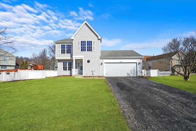 view of front of property with driveway, a front yard, and fence