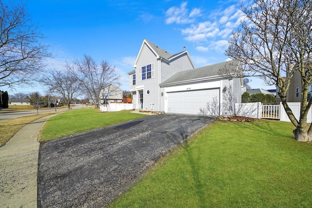 view of side of property featuring a shingled roof, fence, a lawn, a garage, and driveway