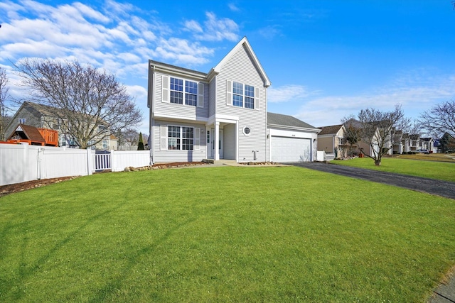 view of front of home featuring aphalt driveway, an attached garage, a front lawn, and fence