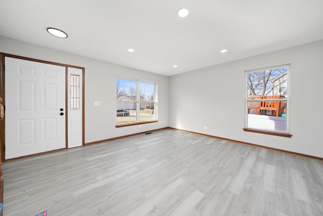 foyer featuring recessed lighting, light wood-type flooring, and a healthy amount of sunlight