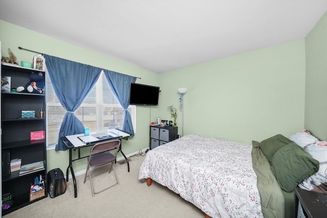 bedroom featuring baseboards and carpet floors