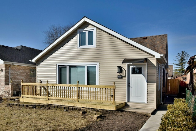 back of house featuring a deck