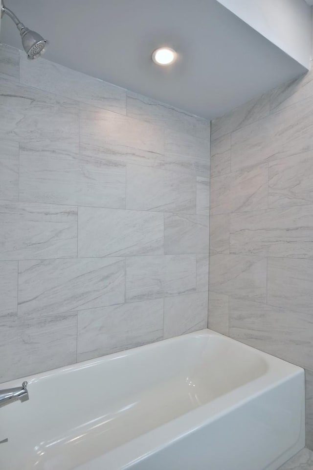 bathroom featuring a bathtub and a shower