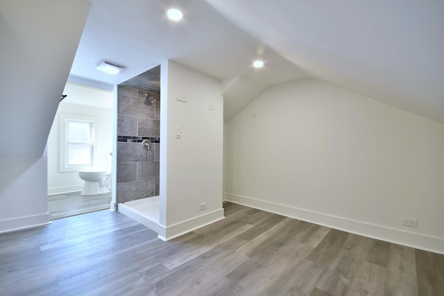 bonus room featuring lofted ceiling, recessed lighting, wood finished floors, and baseboards