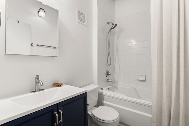 bathroom featuring toilet, shower / bath combo with shower curtain, vanity, and visible vents