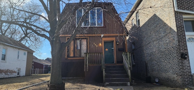 view of front of property featuring fence