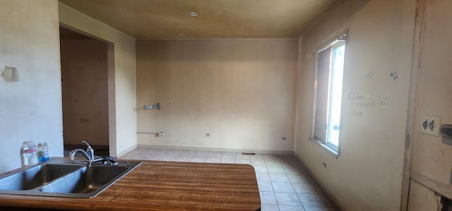 245 153rd Pl, Calumet City, IL 60409 - interior space featuring light tile patterned floors, baseboards, and a sink