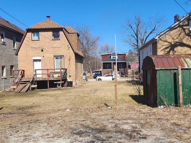 245 153rd Pl, Calumet City, IL 60409 - view of yard with an outdoor structure, a wooden deck, and a shed