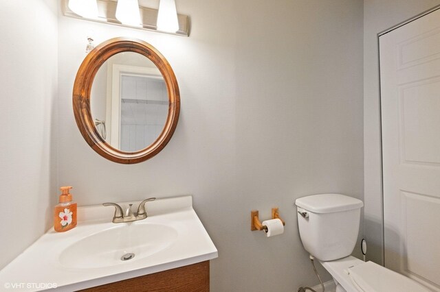 bathroom with vanity and toilet