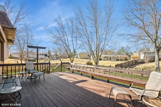 wooden deck featuring a residential view and fence