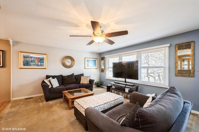 living room featuring visible vents, baseboards, and light carpet