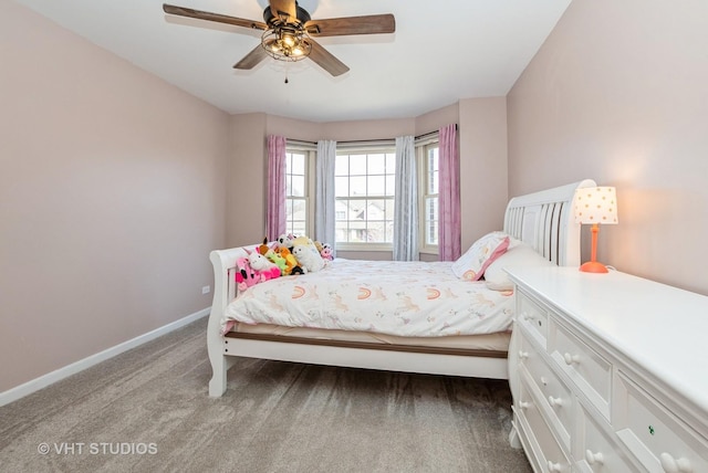 bedroom featuring baseboards, ceiling fan, and carpet flooring