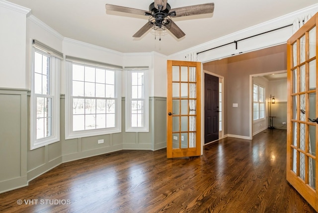 unfurnished room with french doors, wood finished floors, ceiling fan, and ornamental molding