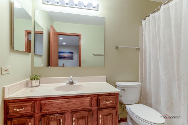 full bath with a shower with shower curtain, toilet, and vanity