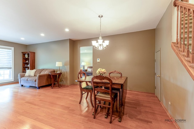 dining room featuring a chandelier, recessed lighting, stairs, and light wood-type flooring