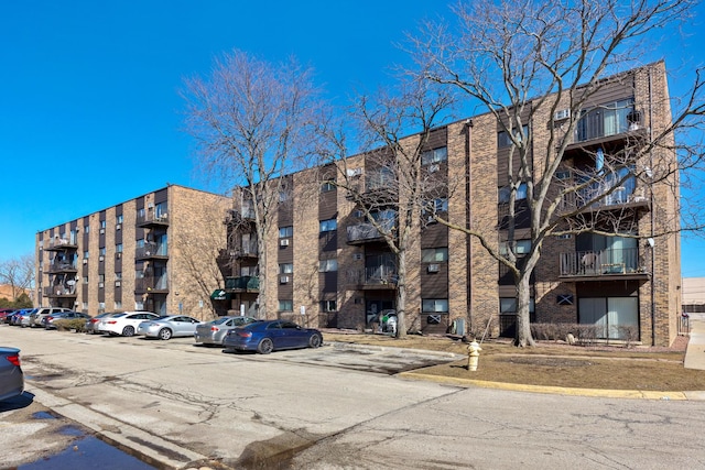 view of property with uncovered parking