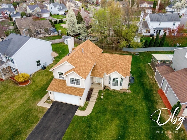 birds eye view of property with a residential view
