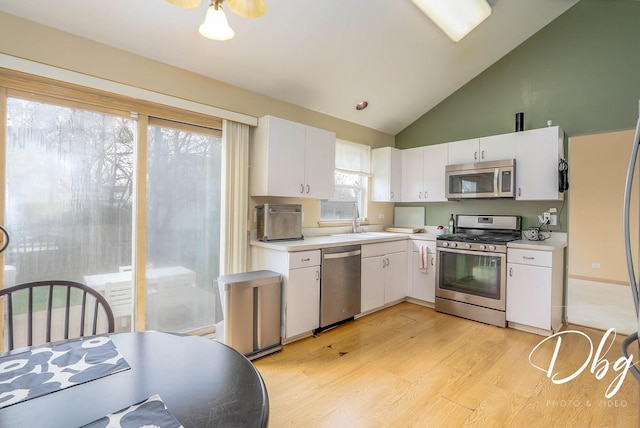 kitchen featuring a sink, light countertops, white cabinets, and stainless steel appliances