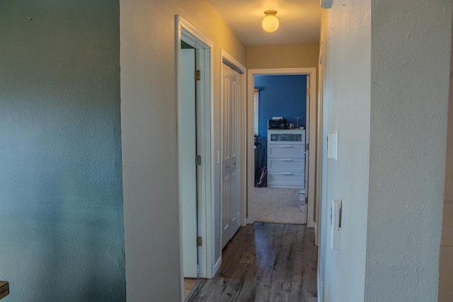 corridor with wood finished floors