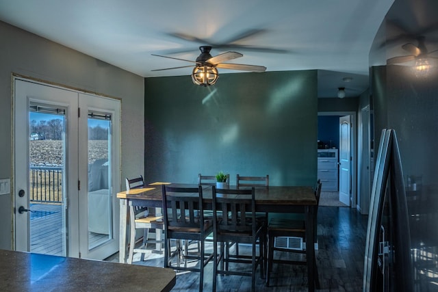 dining space with a ceiling fan and wood finished floors