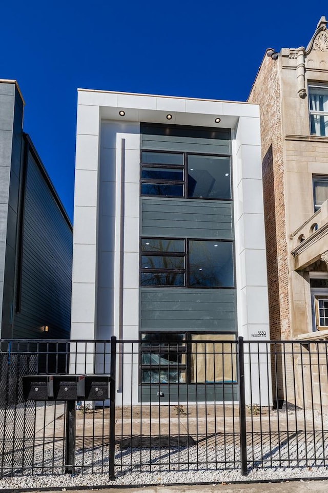 view of building exterior featuring fence