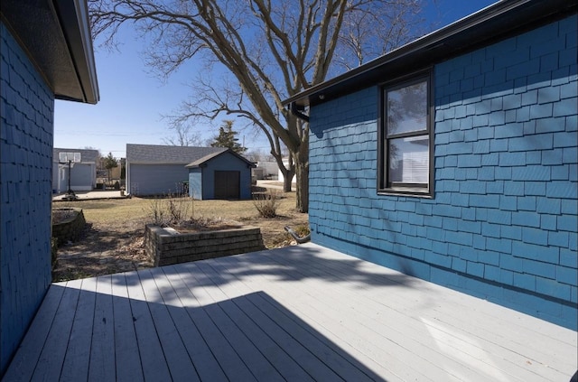 wooden deck featuring an outdoor structure