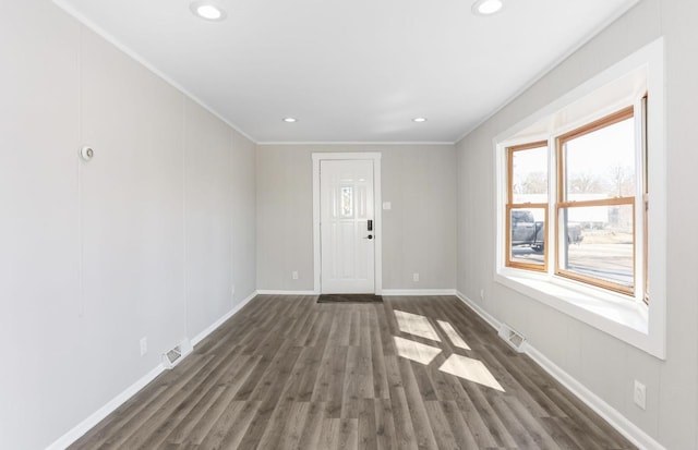 interior space featuring recessed lighting, visible vents, and dark wood-style flooring